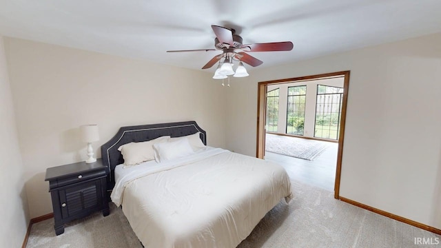 601 E 21st St, Ferdinand, IN 47532 - bedroom with light carpet, ceiling fan, and baseboards