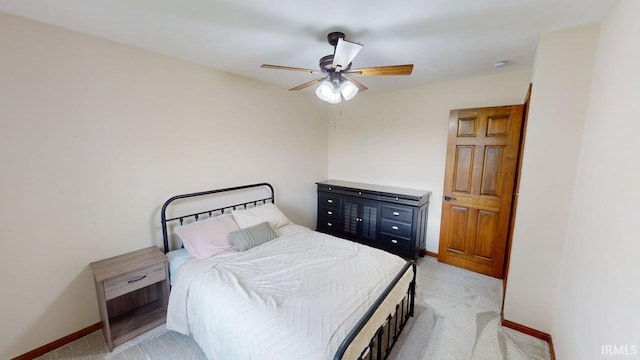 601 E 21st St, Ferdinand, IN 47532 - bedroom with light colored carpet, baseboards, and ceiling fan