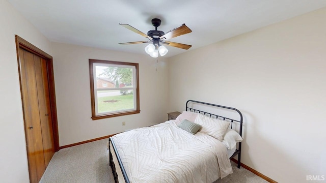 601 E 21st St, Ferdinand, IN 47532 - bedroom featuring light carpet, baseboards, and ceiling fan