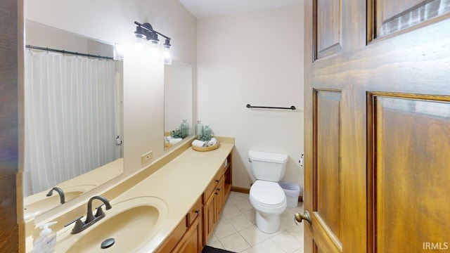601 E 21st St, Ferdinand, IN 47532 - bathroom featuring tile patterned flooring, vanity, toilet, and curtained shower