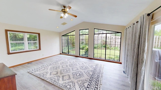 601 E 21st St, Ferdinand, IN 47532 - unfurnished living room with healthy amount of natural light, wood finished floors, a ceiling fan, vaulted ceiling, and baseboards