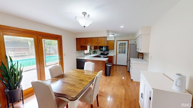 601 E 21st St, Ferdinand, IN 47532 - dining space with light wood-style flooring