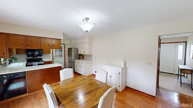 601 E 21st St, Ferdinand, IN 47532 - dining space featuring light wood-type flooring and baseboards