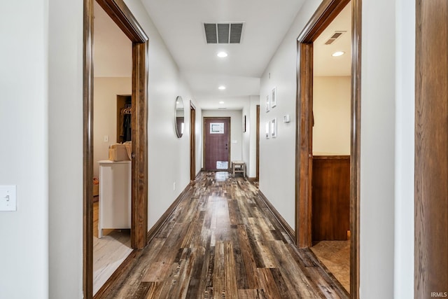hallway featuring dark wood-style floors and recessed lighting