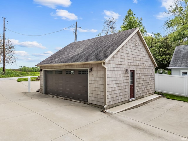 detached garage with fence