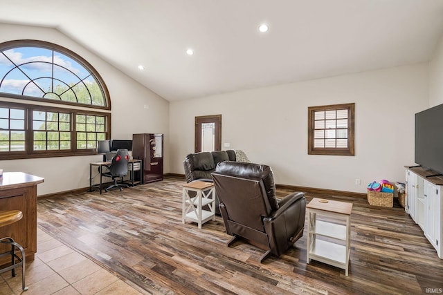 living room featuring plenty of natural light, a desk, baseboards, recessed lighting, and wood finished floors