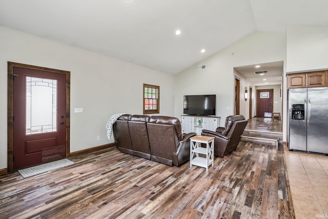 living area with wood finished floors, high vaulted ceiling, recessed lighting, and baseboards