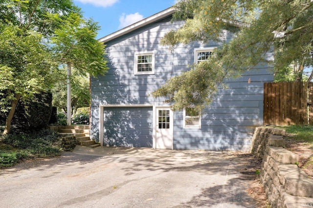 view of property exterior with fence