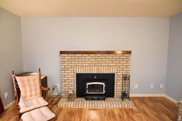 4101 Saddlebrooke Ln, Evansville, IN 47715 - detailed view of wood finished floors, a brick fireplace, and baseboards