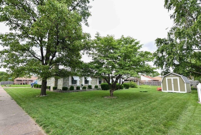 4101 Saddlebrooke Ln, Evansville, IN 47715 - view of yard with a storage unit and an outbuilding