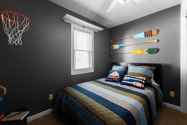 bedroom with ceiling fan and baseboards