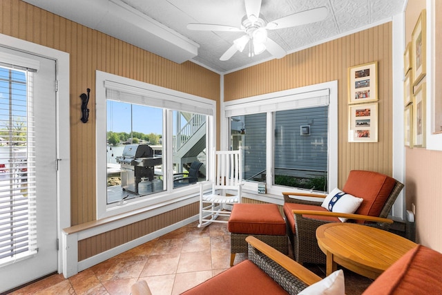 sunroom with a ceiling fan