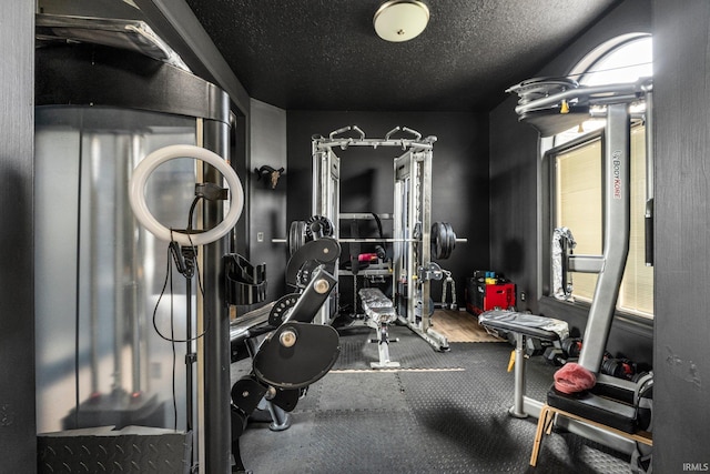 exercise area with a textured ceiling