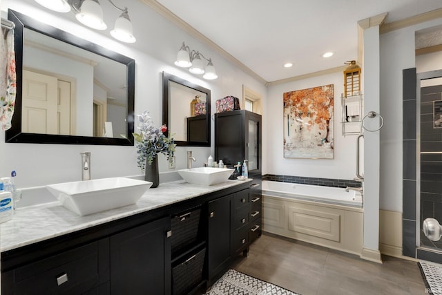 full bath featuring ornamental molding, double vanity, a garden tub, tile patterned flooring, and recessed lighting