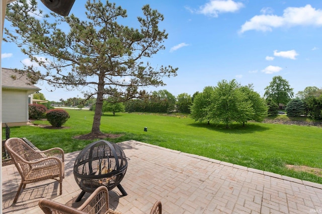 view of patio / terrace with an outdoor fire pit