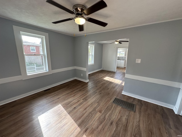 807 Walnut St, Oolitic, IN 47451 - empty room with wood finished floors, a ceiling fan, baseboards, and crown molding