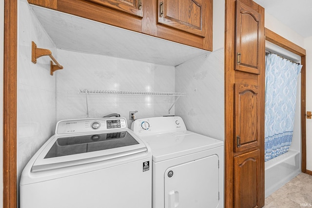washroom with washer and clothes dryer