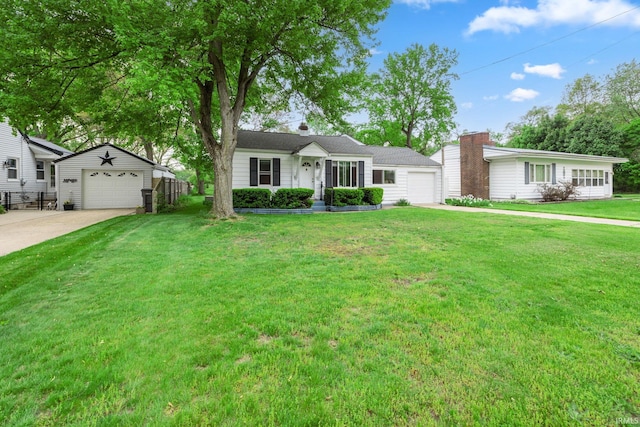 ranch-style home with driveway, a garage, and a detached garage