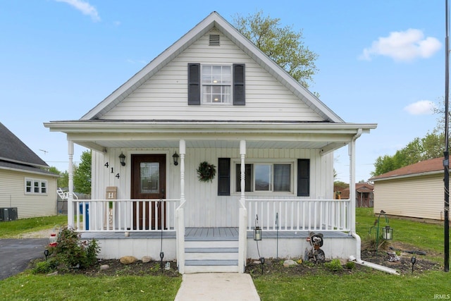 414 Monroe St, Monroeville, IN 46773 - view of front of property featuring covered porch and cooling unit