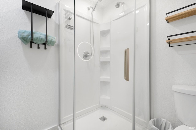 414 Monroe St, Monroeville, IN 46773 - bathroom with a stall shower, toilet, and a textured wall