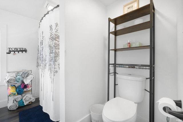 414 Monroe St, Monroeville, IN 46773 - bathroom with wood finished floors, baseboards, and toilet