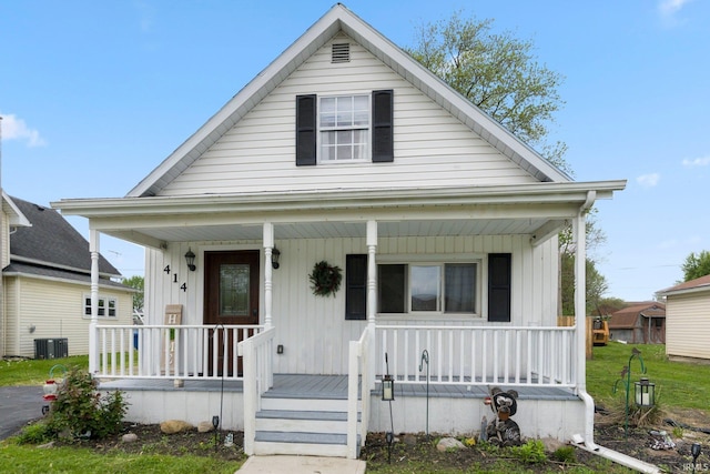 414 Monroe St, Monroeville, IN 46773 - bungalow featuring a porch and central AC unit