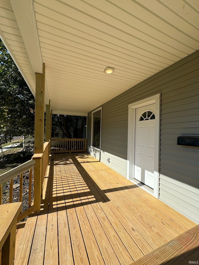 wooden deck featuring covered porch