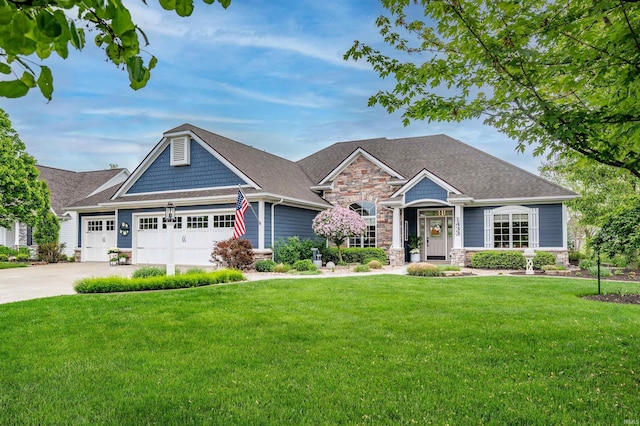 1433 Jacobs Dr, Fort Wayne, IN 46814 - craftsman-style house featuring stone siding, an attached garage, a front yard, concrete driveway, and a shingled roof
