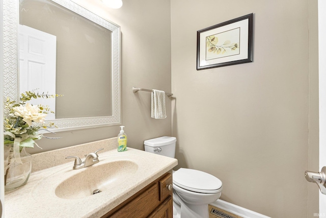 half bath with toilet and vanity