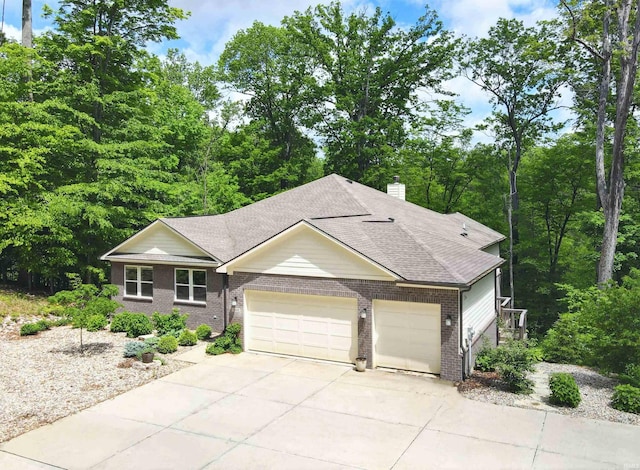 1846 E Cumberland Ter, Martinsville, IN 46151 - ranch-style home with a garage, brick siding, concrete driveway, a chimney, and a shingled roof