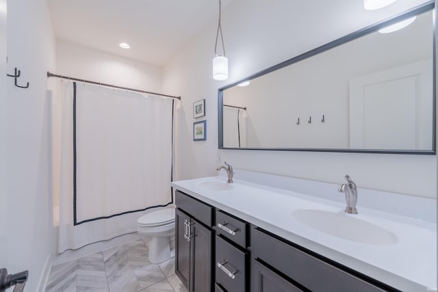 1846 E Cumberland Ter, Martinsville, IN 46151 - bathroom featuring toilet, double vanity, and shower / tub combo