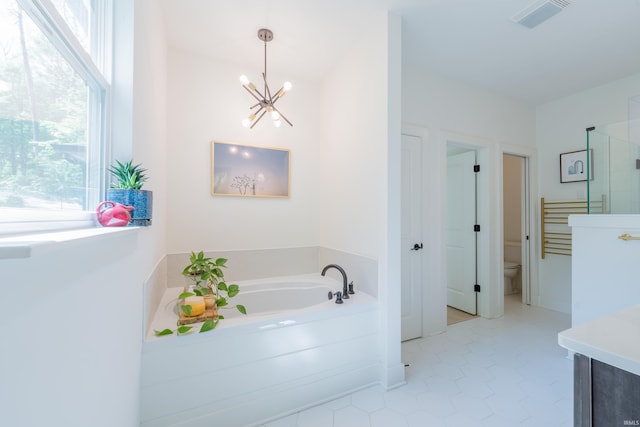 1846 E Cumberland Ter, Martinsville, IN 46151 - full bathroom with a chandelier, plenty of natural light, a garden tub, and toilet