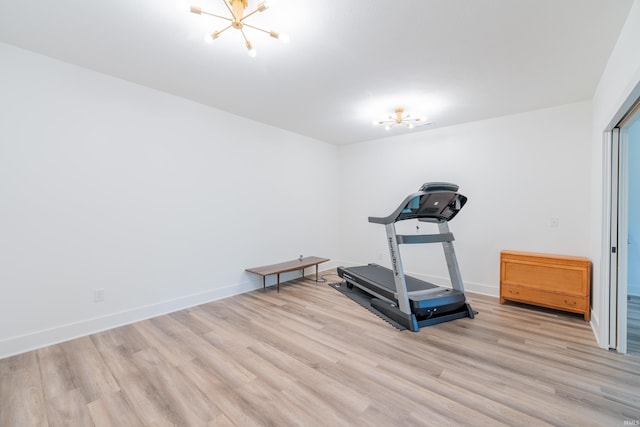 1846 E Cumberland Ter, Martinsville, IN 46151 - workout room with a chandelier, light wood-style flooring, and baseboards