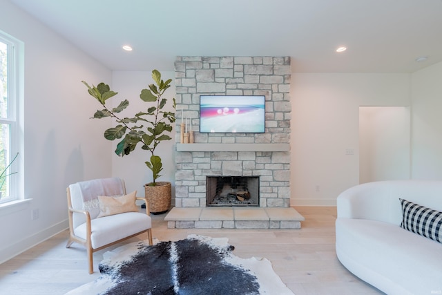 1846 E Cumberland Ter, Martinsville, IN 46151 - living room with a stone fireplace, wood finished floors, recessed lighting, and baseboards