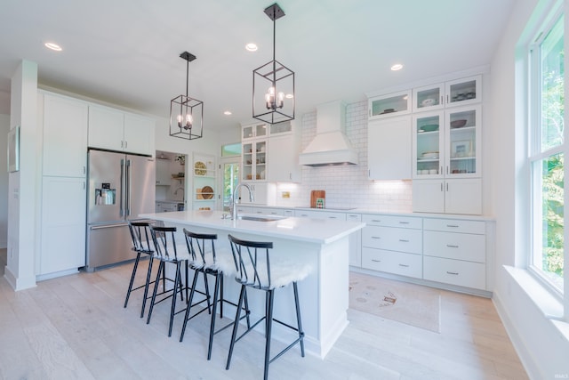 1846 E Cumberland Ter, Martinsville, IN 46151 - kitchen with high end refrigerator, a sink, custom range hood, light countertops, and a breakfast bar area