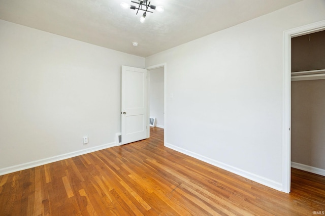 1425 Adams St, Lafayette, IN 47905 - unfurnished bedroom featuring light wood-type flooring, baseboards, and a closet