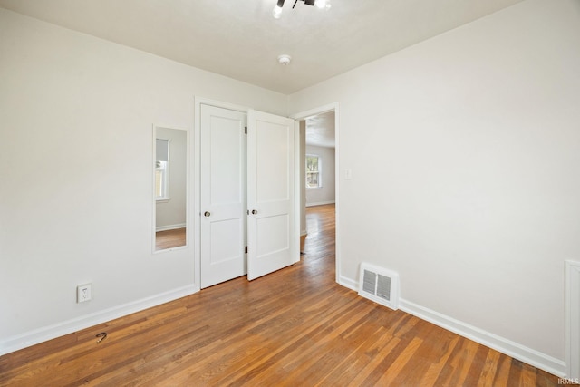 1425 Adams St, Lafayette, IN 47905 - unfurnished bedroom with wood finished floors and baseboards