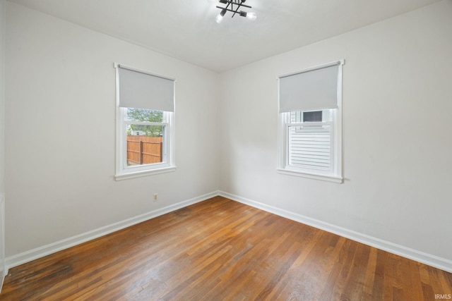 1425 Adams St, Lafayette, IN 47905 - empty room with wood finished floors and baseboards