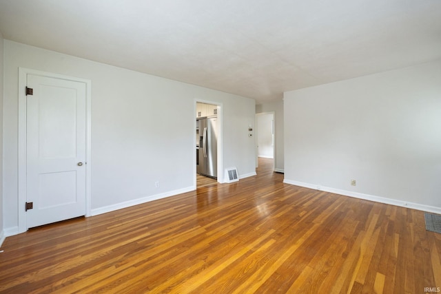 1425 Adams St, Lafayette, IN 47905 - unfurnished room with wood finished floors and baseboards
