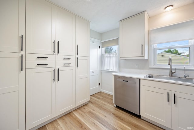 1425 Adams St, Lafayette, IN 47905 - kitchen with dishwasher, a sink, light wood-type flooring, and healthy amount of natural light