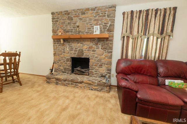 living room featuring carpet, a textured ceiling, a fireplace, and baseboards