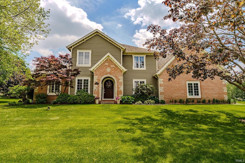3935 Shana Jane Dr, Lafayette, IN 47905 - traditional-style home featuring brick siding and a front lawn