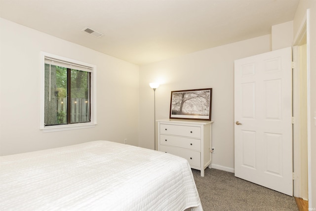 bedroom featuring carpet flooring and baseboards