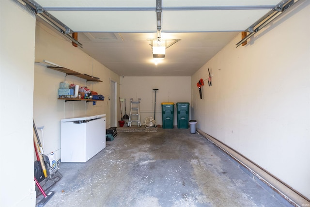 garage with refrigerator and a garage door opener