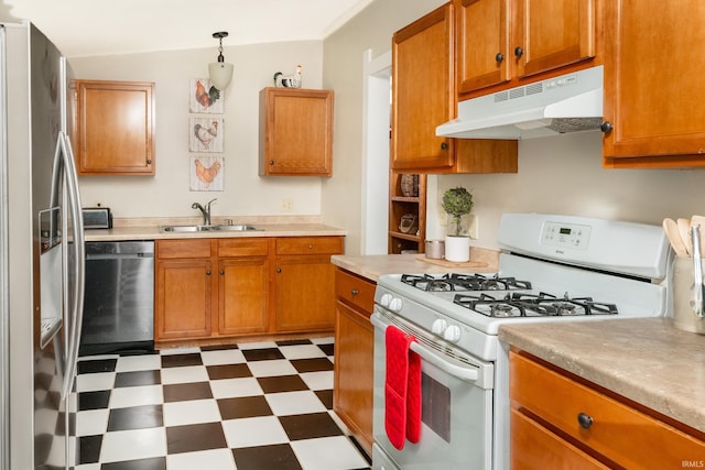 kitchen with white range with gas cooktop, a sink, under cabinet range hood, dishwasher, and stainless steel refrigerator with ice dispenser