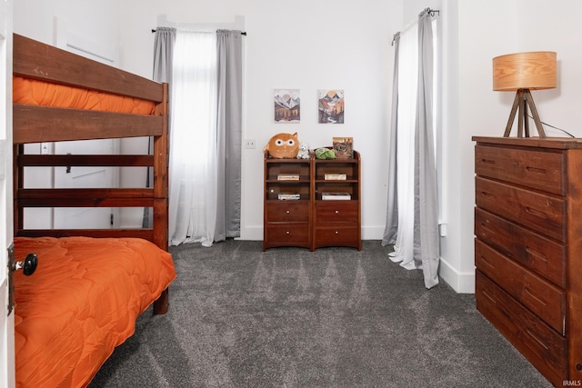 bedroom featuring carpet flooring and baseboards