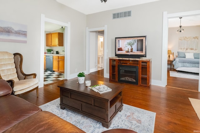 living area featuring wood finished floors and baseboards