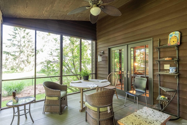 sunroom featuring french doors, a ceiling fan, and vaulted ceiling