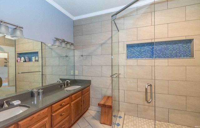 bathroom featuring crown molding, a shower stall, tile walls, double vanity, and tile patterned floors