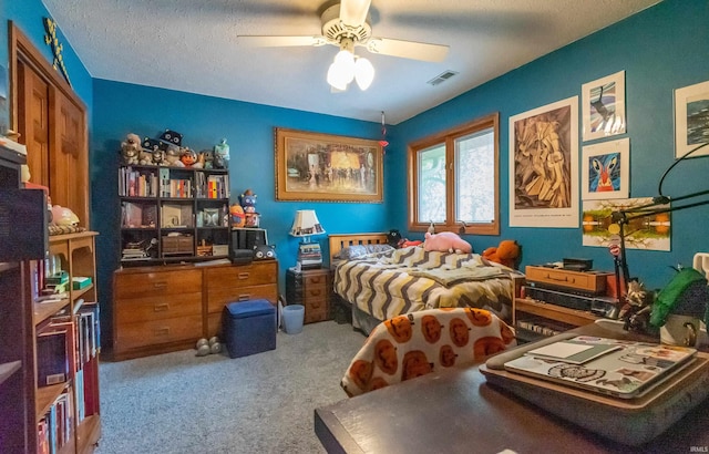 carpeted bedroom with a ceiling fan